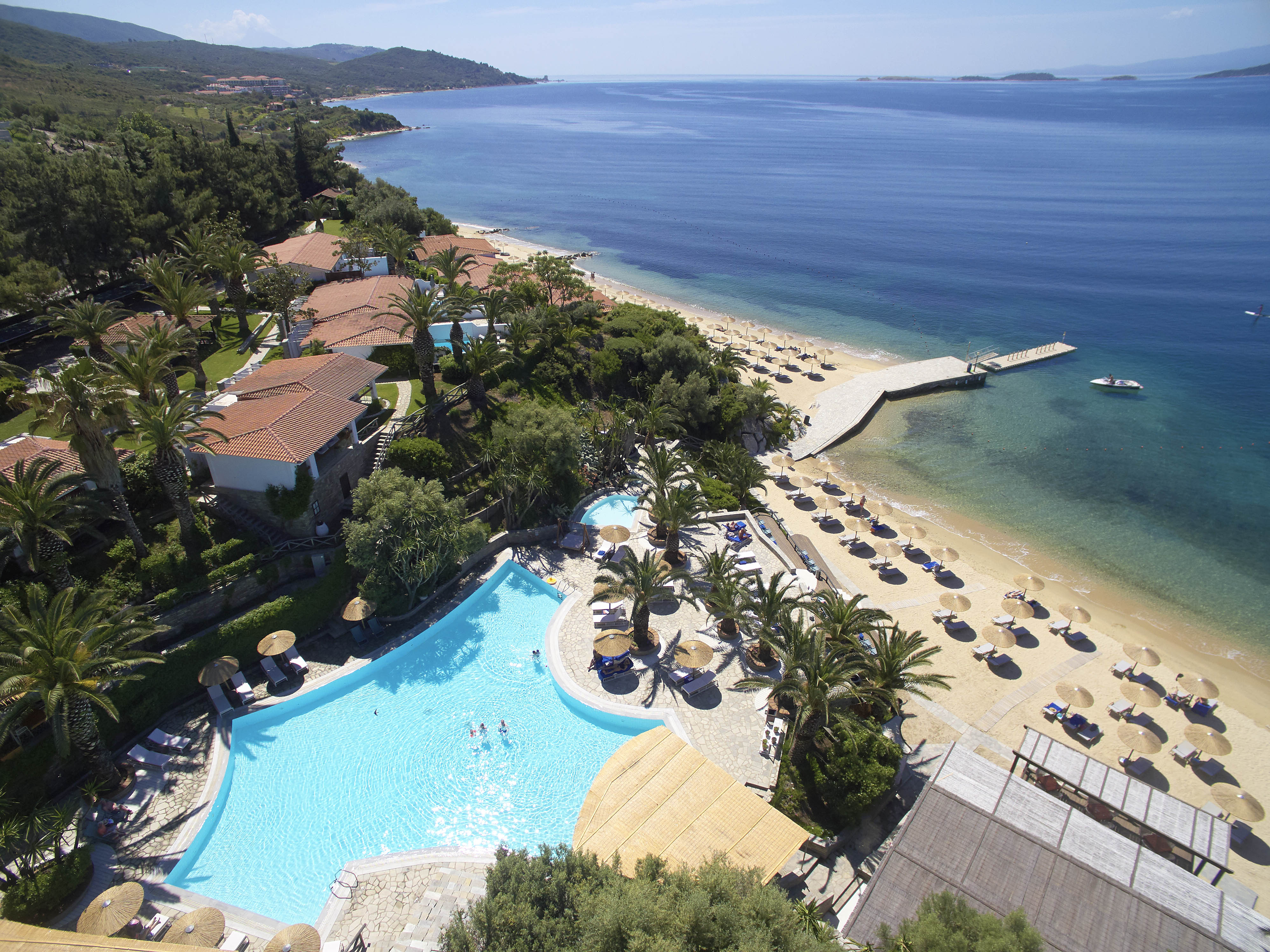 
Aerial view of Eagles Resort with pool, beachfront and pier overlooking the sea 