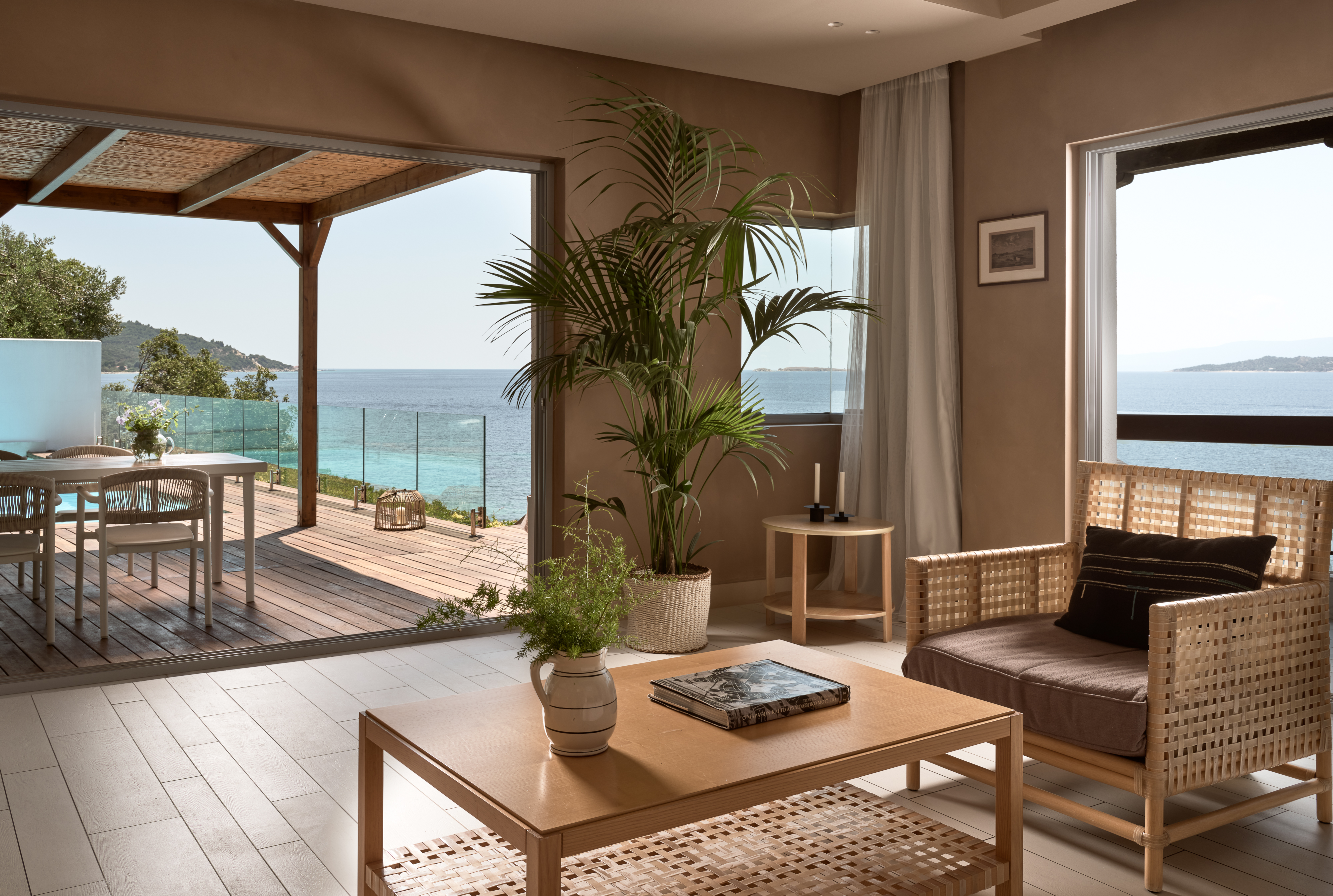
Sea view living room with rattan sitting and pergola terrace with living area near the pool in Eagles Palace