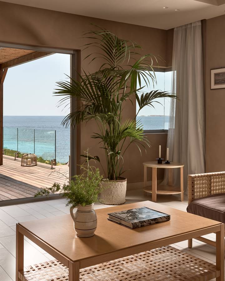 Sea view living room with rattan sitting and pergola terrace with living area near the pool in Eagles Palace