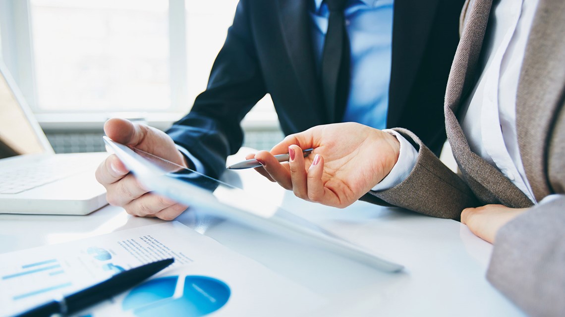 Business consulting meeting with charts, tablet and documents, TOR Hotel Group